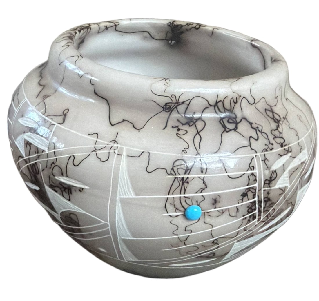 Navajo Etched Pottery Vessel with Turquoise Accents: Handcrafted Navajo pottery vessel featuring etched designs with geometric patterns and traditional marbled horsehair details. Accented with small turquoise stones. Signed on the base. Includes a paper