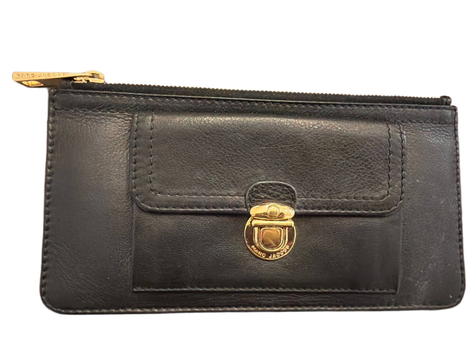 Marc Jacobs Black Leather Wallet with Gold-Tone Hardware: Marc Jacobs black leather wallet featuring gold-tone hardware, including a prominent front clasp engraved with the designer's name. Slim design with zip-around closure and a front slip pocket. Interio