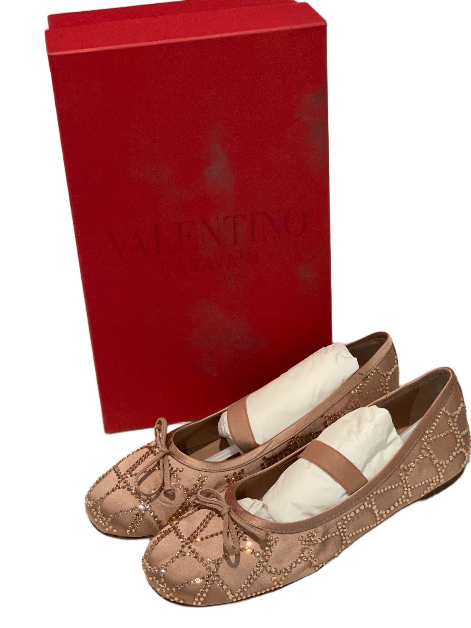 Valentino Garavani Embellished Ballerina Flats with Original Box, Size 38.5: Valentino Garavani ballerina flats featuring a blush satin finish with a quilted design adorned with small faceted studs. Includes grosgrain ribbon trim and bow detail at the toe. Rubber soles with br