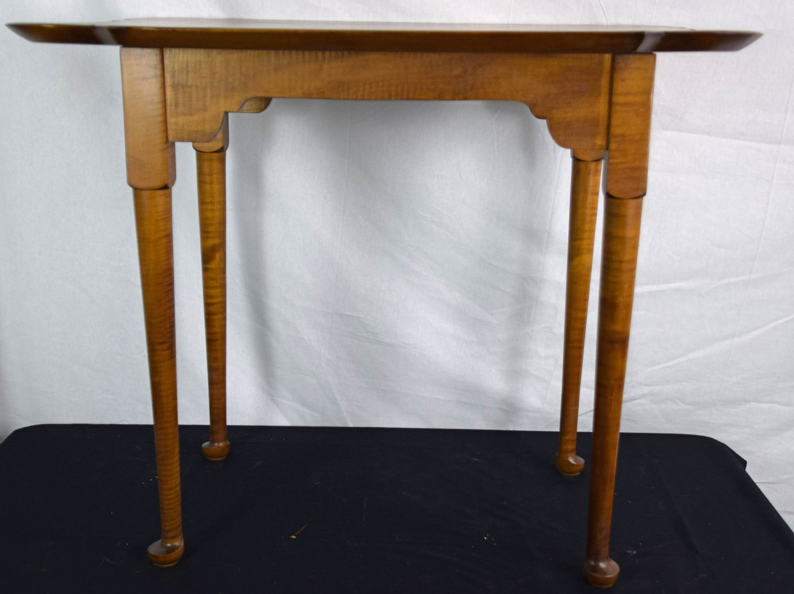 Pair of Tea Tables: Nice pair of bench made tiger maple Queen Anne style tea tables with porringer top on pad feet. Dimensions: 33" length 24.5" Width 27.5 " Height