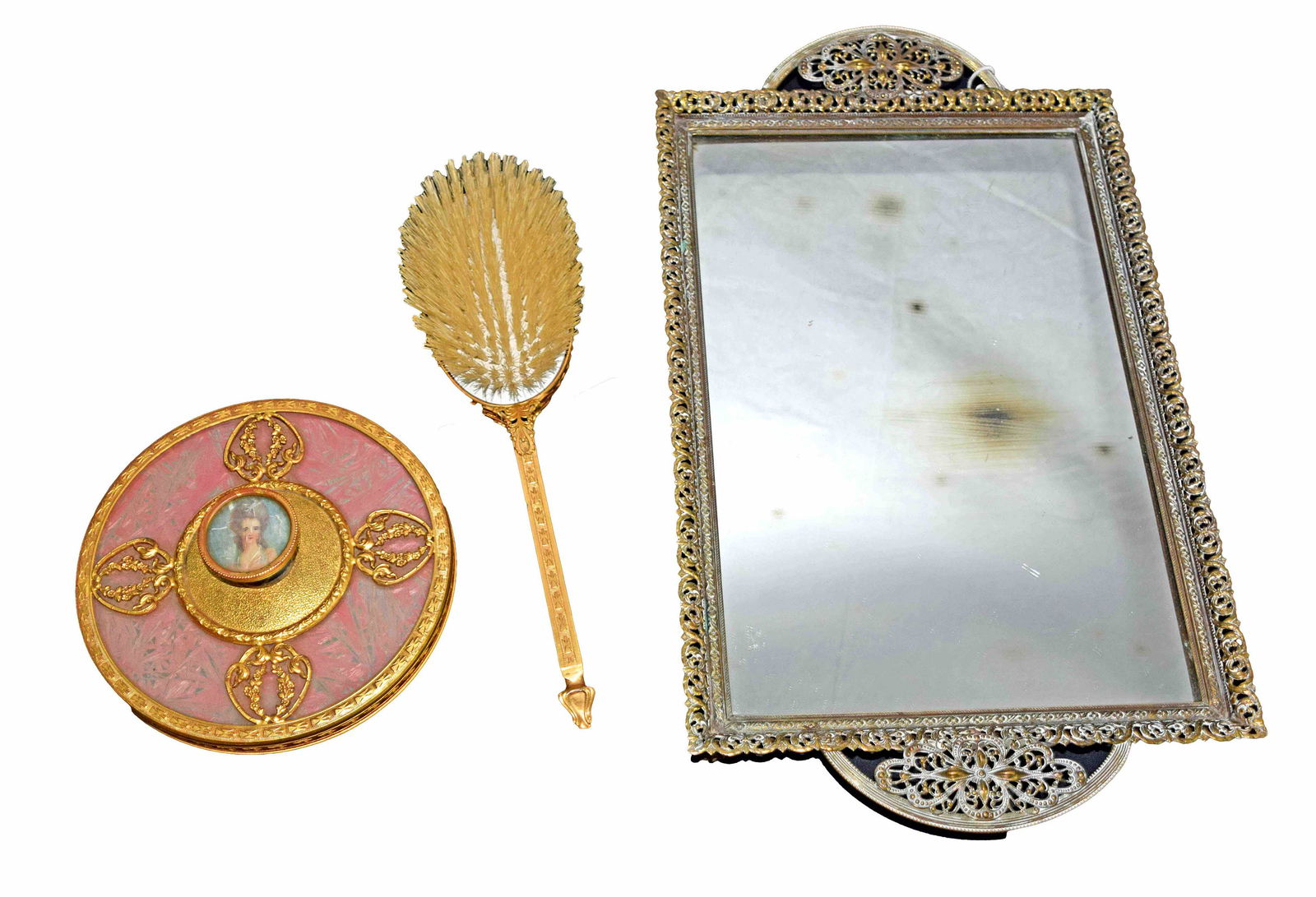 Lady's Boudoir Set Apollo Studios of New York: Lady's boudoir set to include: Hand mirror with brush by Apollo Studios with portraits. Accompanied by a mirror tray by unknown maker. Dimensions: 6" Diameter for hand mirror, 11" Length of Hair Brush