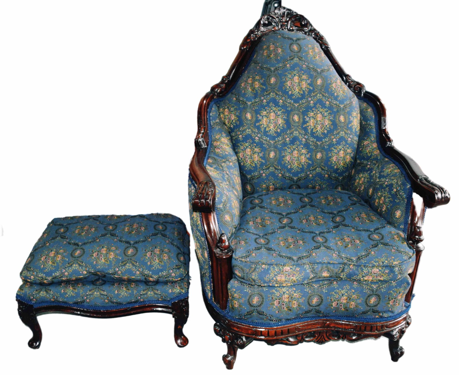 Victorian Easy Chair: Elegant Victorian easy chair with footstool, carved arms and legs, superior upholstery Dimensions 19" Seat Height, 49" Overall Height, 15.5" Footstool Height
