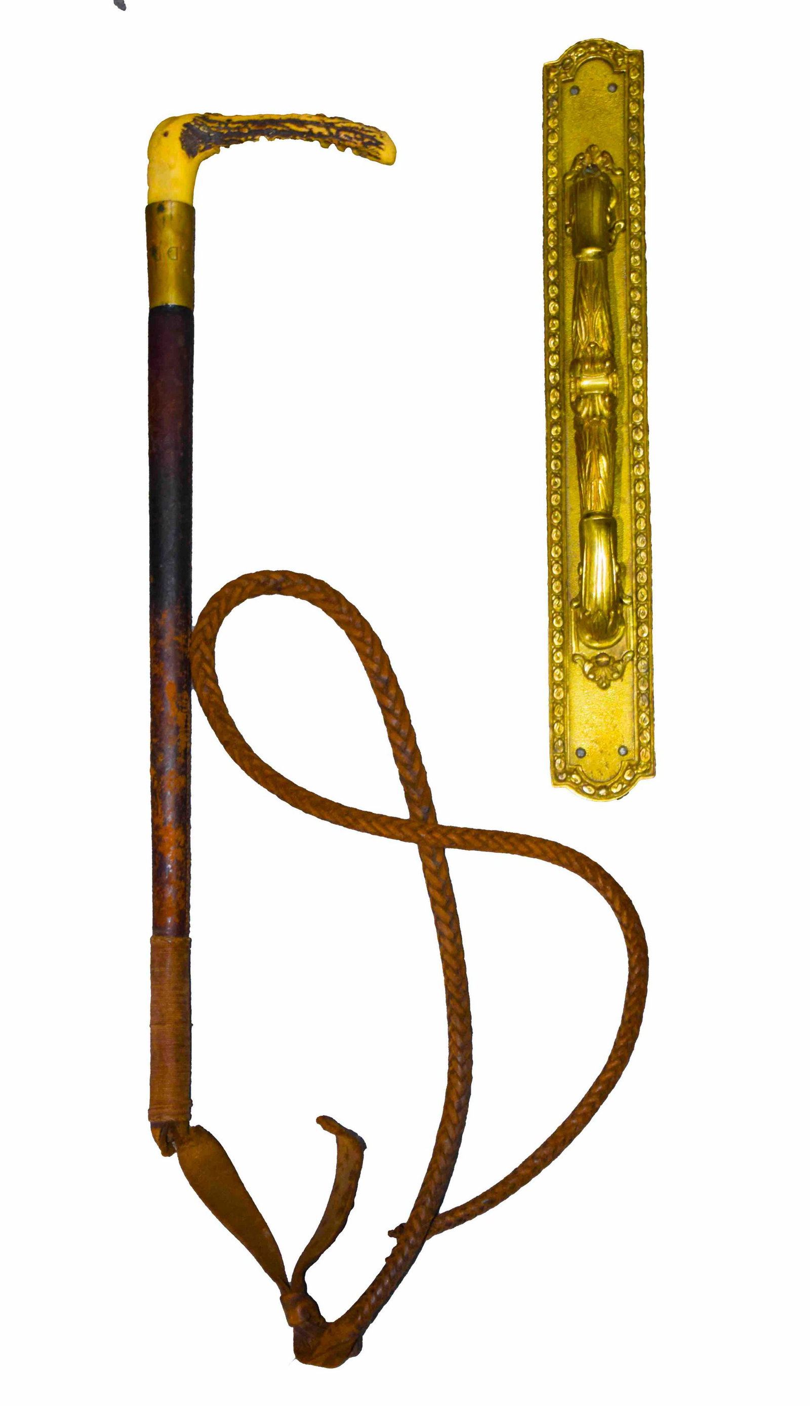 Two Piece Lot: Decorated Victorian brass door handle along with a 19th century buggy whip with bone handle. Dimensions: 14" Door Handle Height