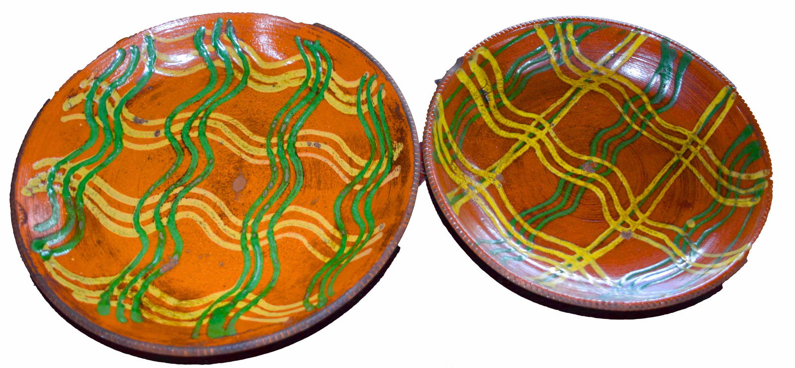 Redware: Two latter Redware plates with decorations. Dimension: 8" and 9.5" Diameters