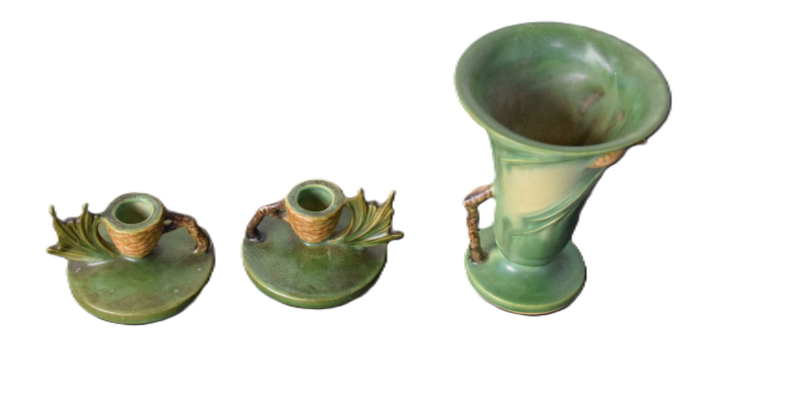 Roseville Lot: A Roseville lot including a vase with acorns and oak branches (6.5" Height) and a pair of candlesticks (2.5" Height)