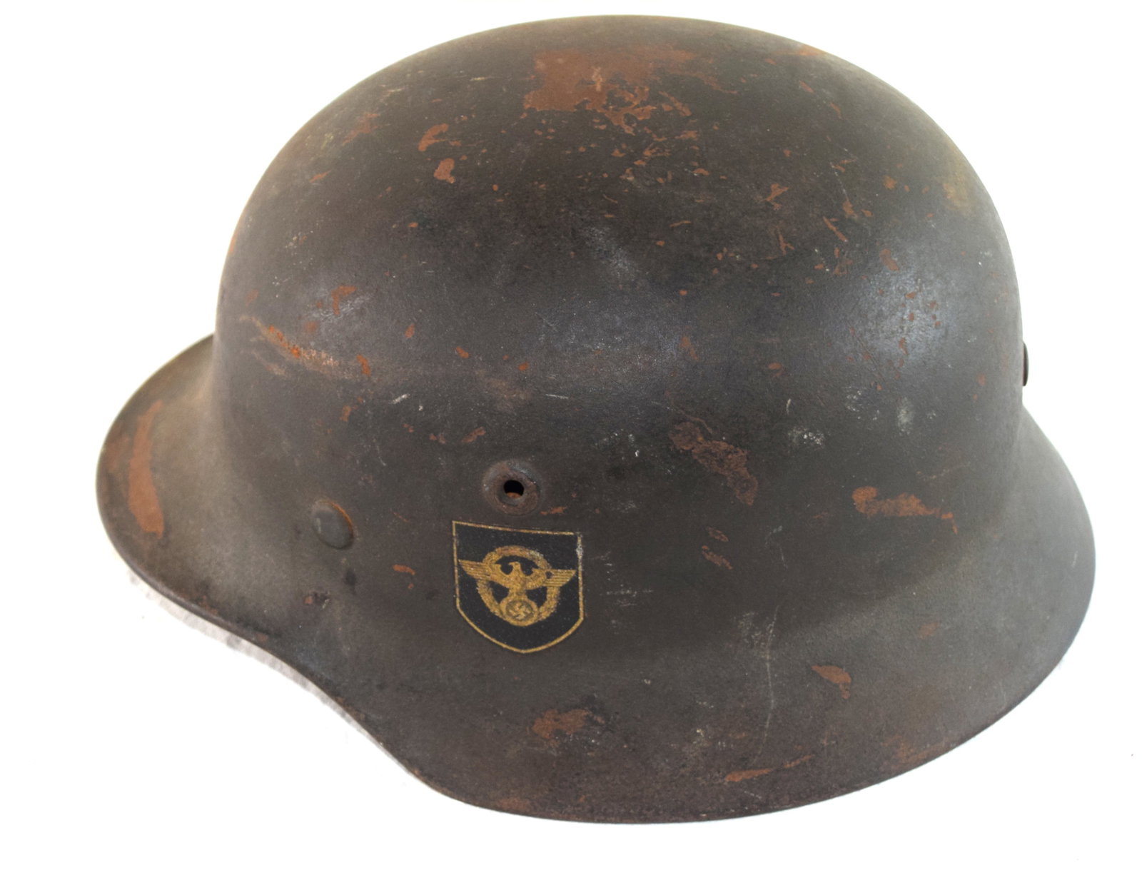 German WW II Helmet: German police WWII helmet with double decal, complete with liner and chin strap. Fitted with its correct M.40 liner and zinc liner band with its nice toned to gold police non-bordered decal with the s
