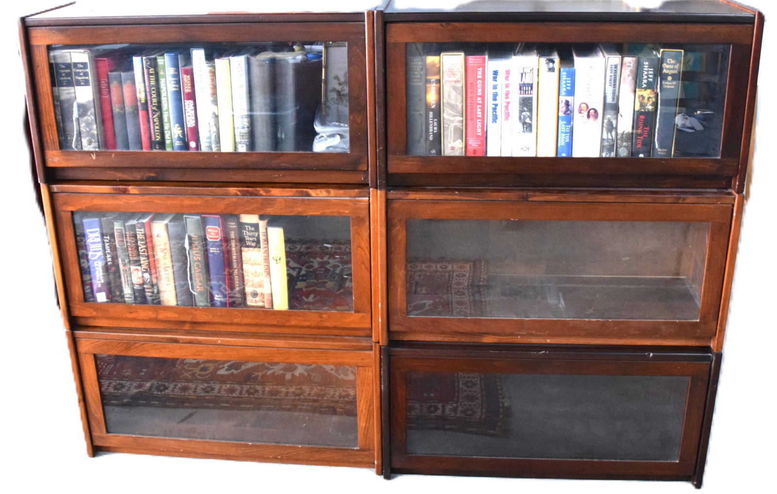 Pair of Bannister Bookcases: Pasir of Bannister bookcases each with three stackable units with glass doors. Dimensions: 49" x 33" x13"