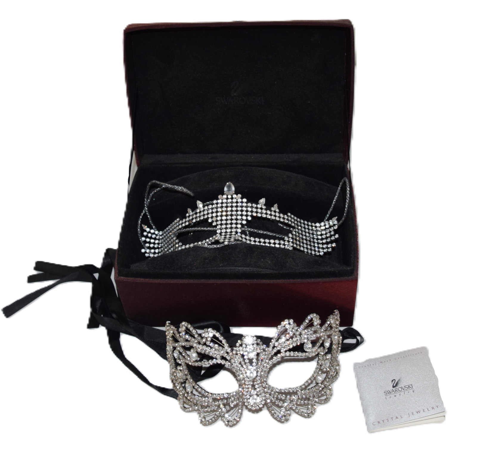 Crystal Swarovski Masks: Two crystal masks, one special edition with genuine Swarovski crystal, all hand cut and with certificate of authenticity and original box. Other mask is crystal but not a Swarovski.