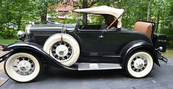 1931 Deluxe Model A: 1931 Deluxe Model A with all the bells and whistles. Forest green body with black fenders, brown leather interior, Runs well. All the accessories-leather trunk, rumble seat, trim, mirrors on spare tir