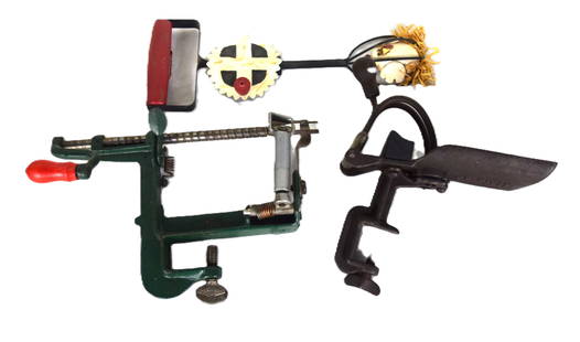 Country Lot: Iron apple peeler made by Goodell Co., Antrim NH labeled "White Mountain Apple" along with a cherry stone picker by Goodell Co. Dimensions: 9" H and 7" H