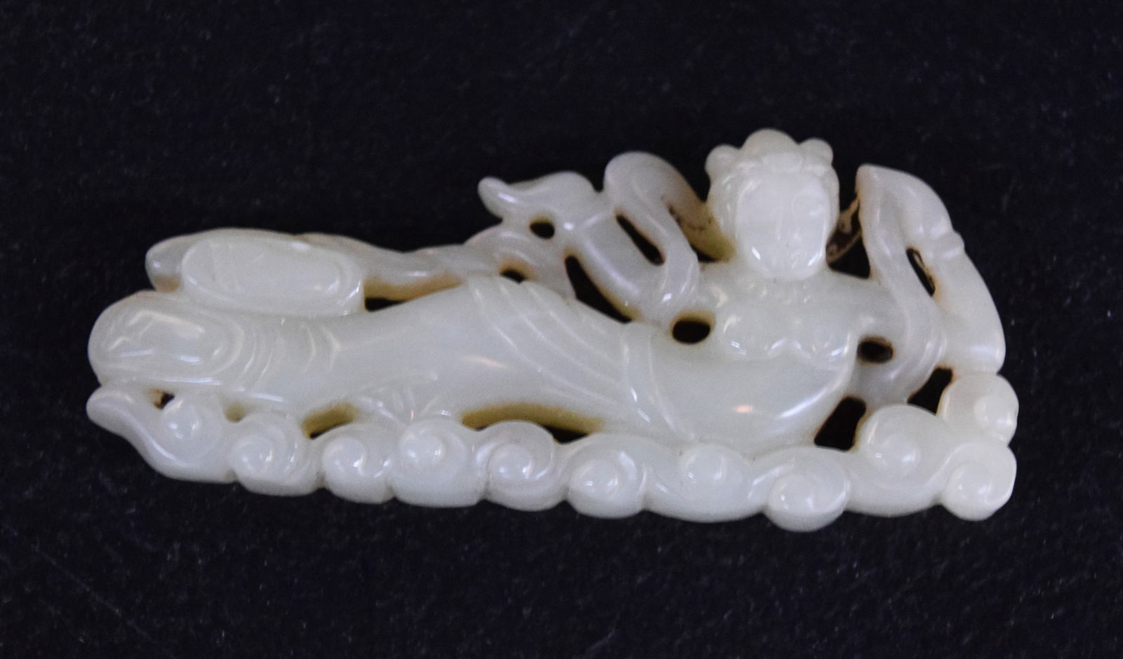 Early Jade Goddess: Intricately and early carved goddess on a base of sea waves. Dimensions: 3.5" L