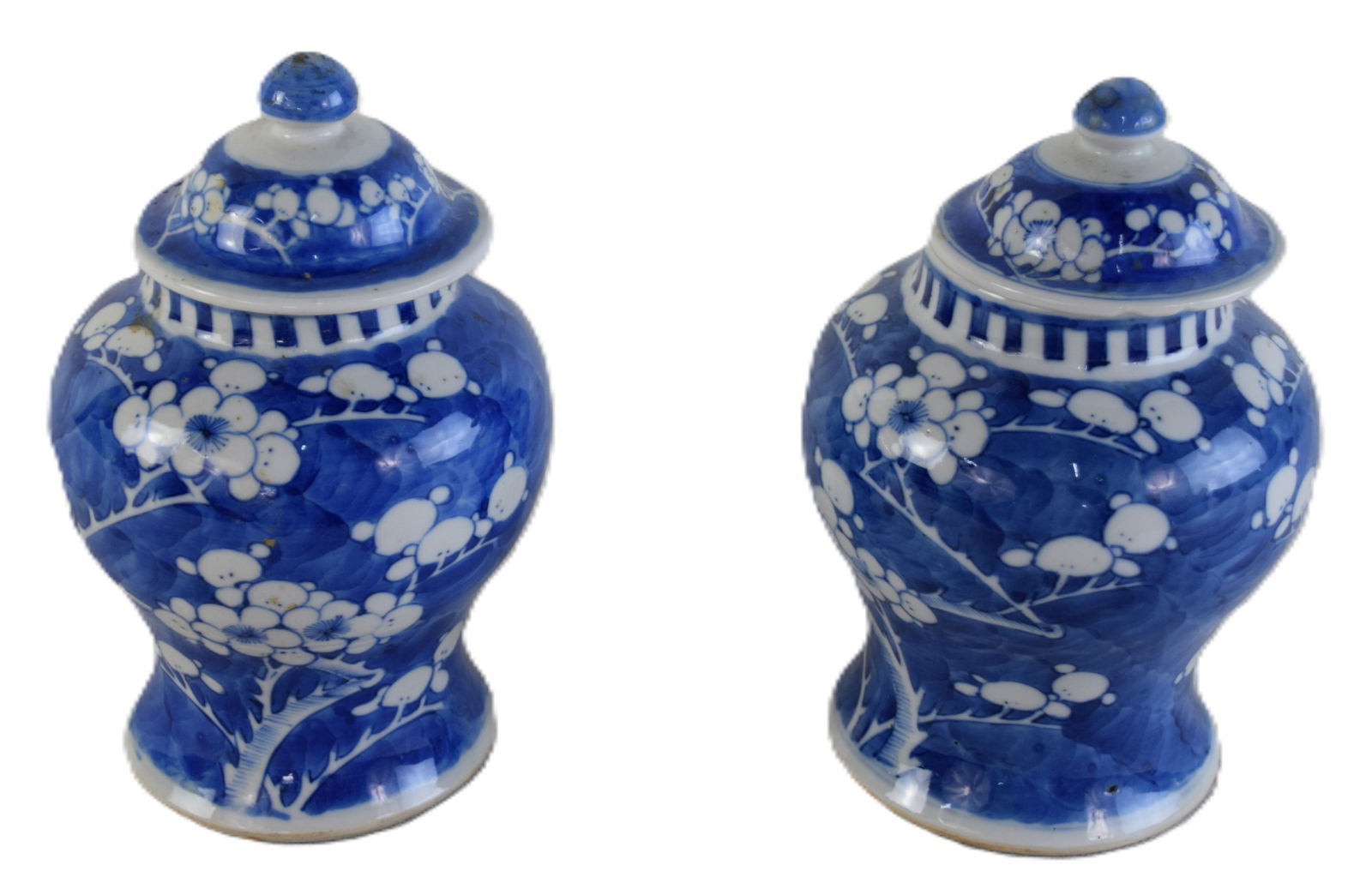 Pair Of Chinese Jars: Pair of Chinese glazed porcelain jars with lids and with floral design and with round blue circular mark on bottom. Dimensions: 9"H