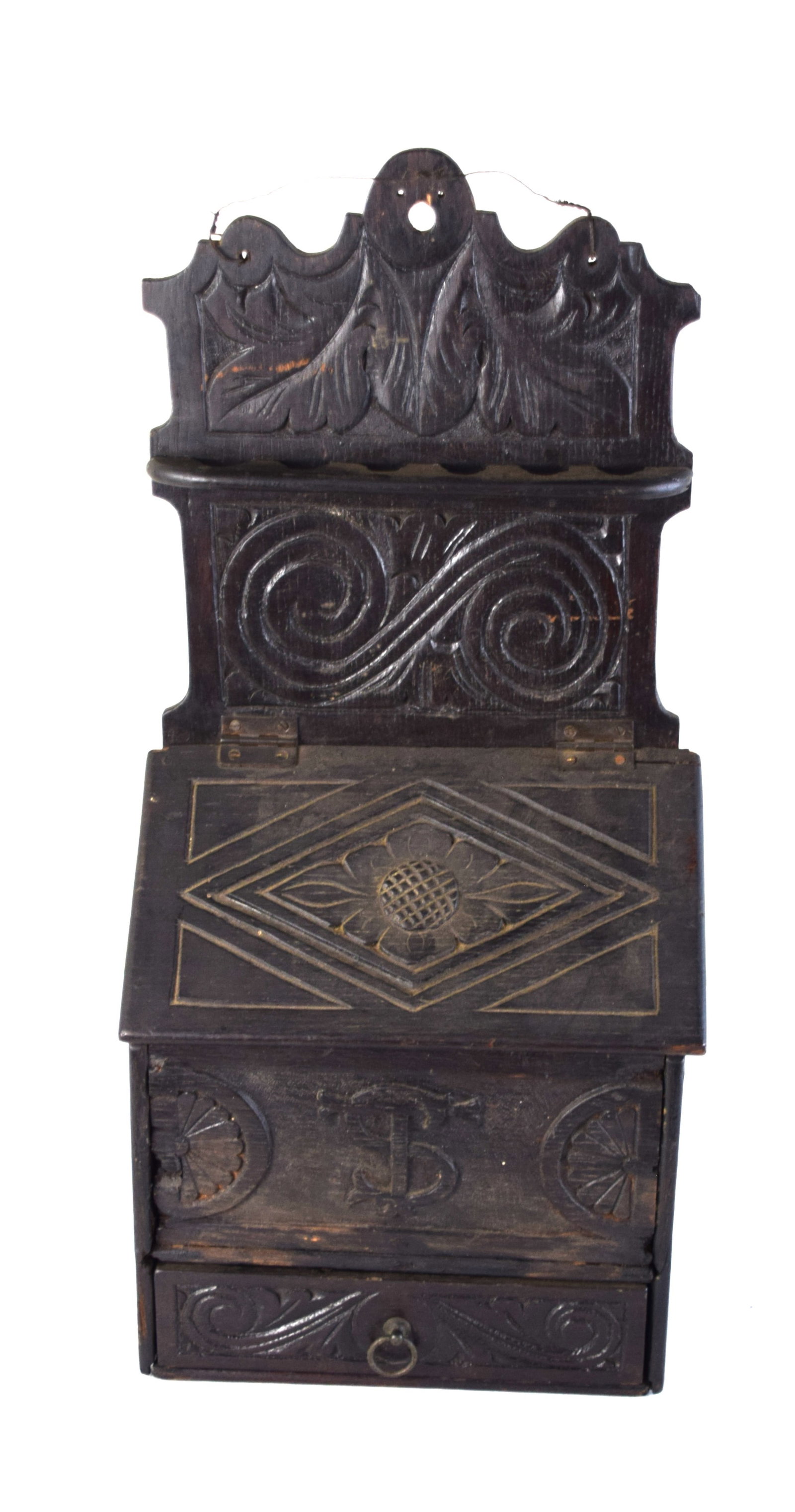 17th Century English Oak Pipe Box: A well carved 17th Century English oak pipe box with carvings all over box, initials TS, Tudor rose carvings, 6 slots for pipes, hinged slant lid over box and a lower drawer, all carved nicely. Dimens