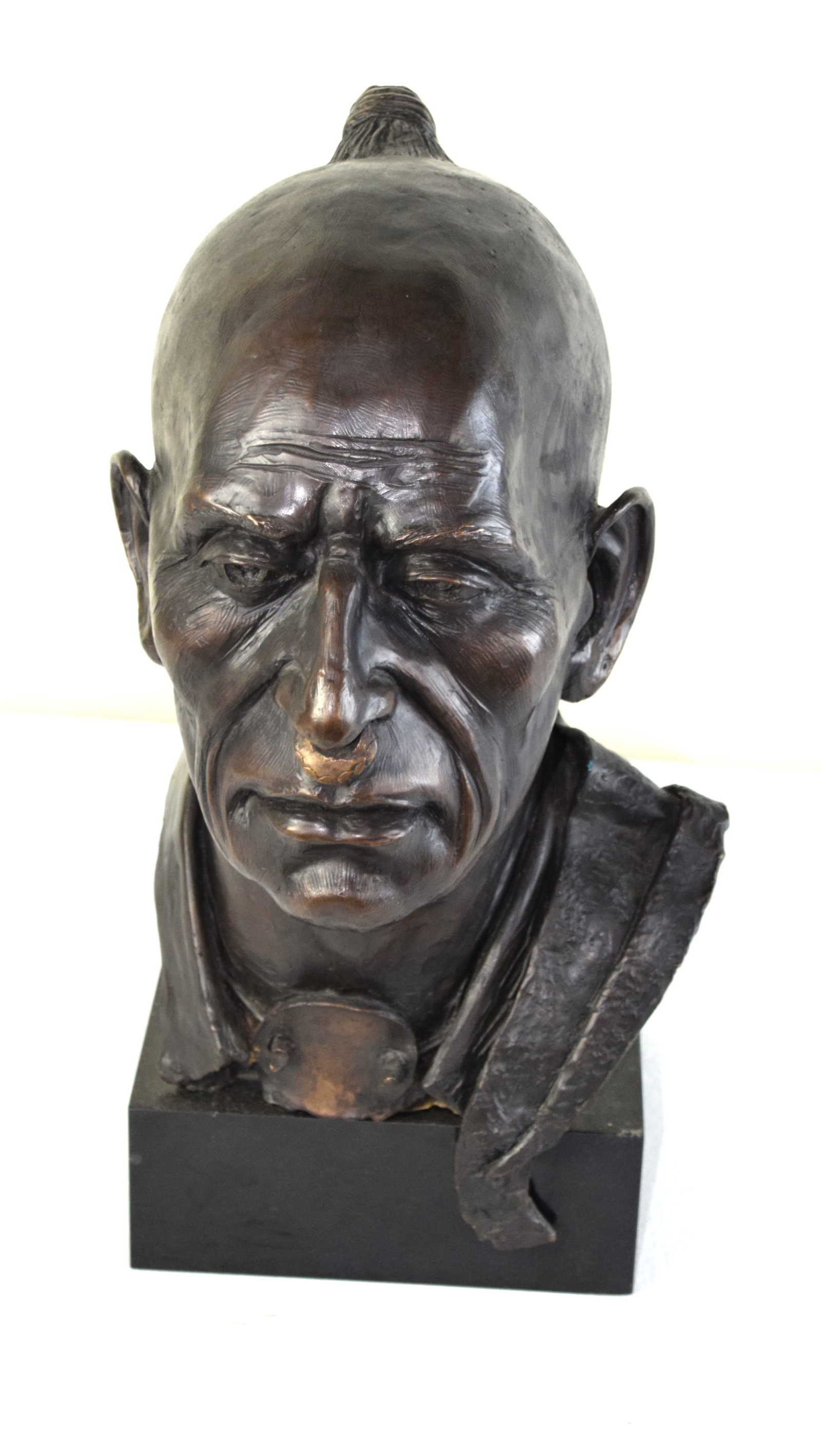 Philip Cote Sculpture Of An Indian Chieftain: Bronze bust of an Indian Chief signed Cote on back, resting on a marble base. Philip Cote is a?Moose Deer Point First Nation?artist, activist, historian, and traditional wisdom keeper, with affiliatio