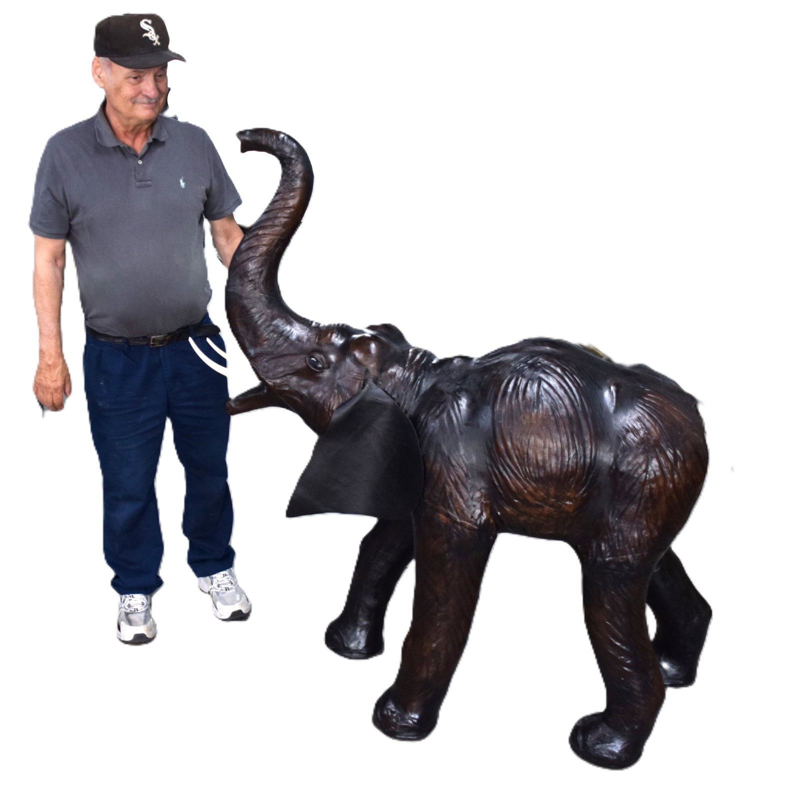 Large Leather Elephant: This a great example of a circa 1905 Moroccan leather elephant sculpture. The elephant has been eloquently detailed with all of his wondrous wrinkles and glass eyes. This is no mid-century