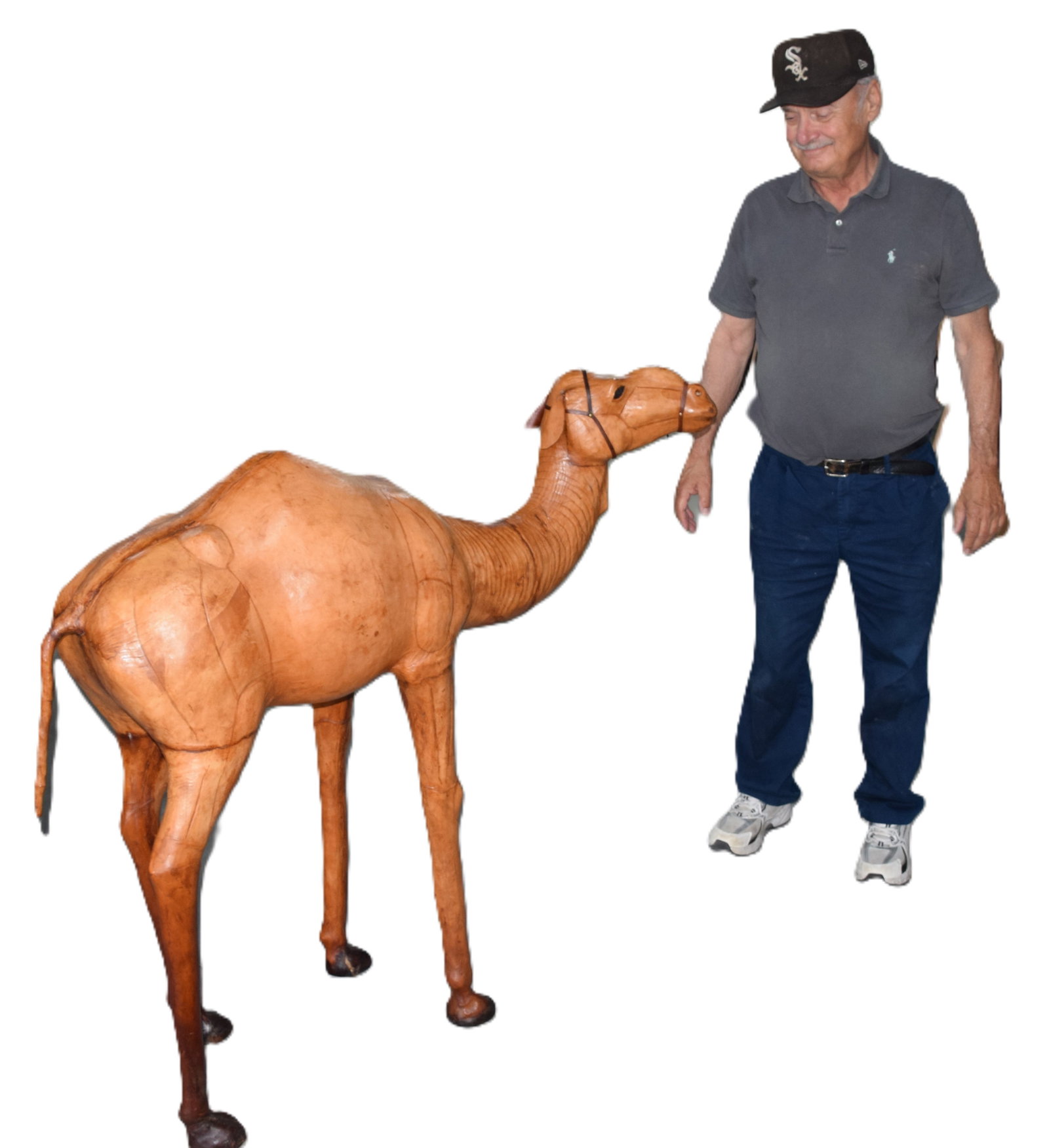 Large leather Camel: This a great example of a circa 1905 Moroccan leather camel sculpture. This camel has been eloquently detailed with glass eyes. This is no mid-century reproduction. Dimensions: 43" Height x 50"