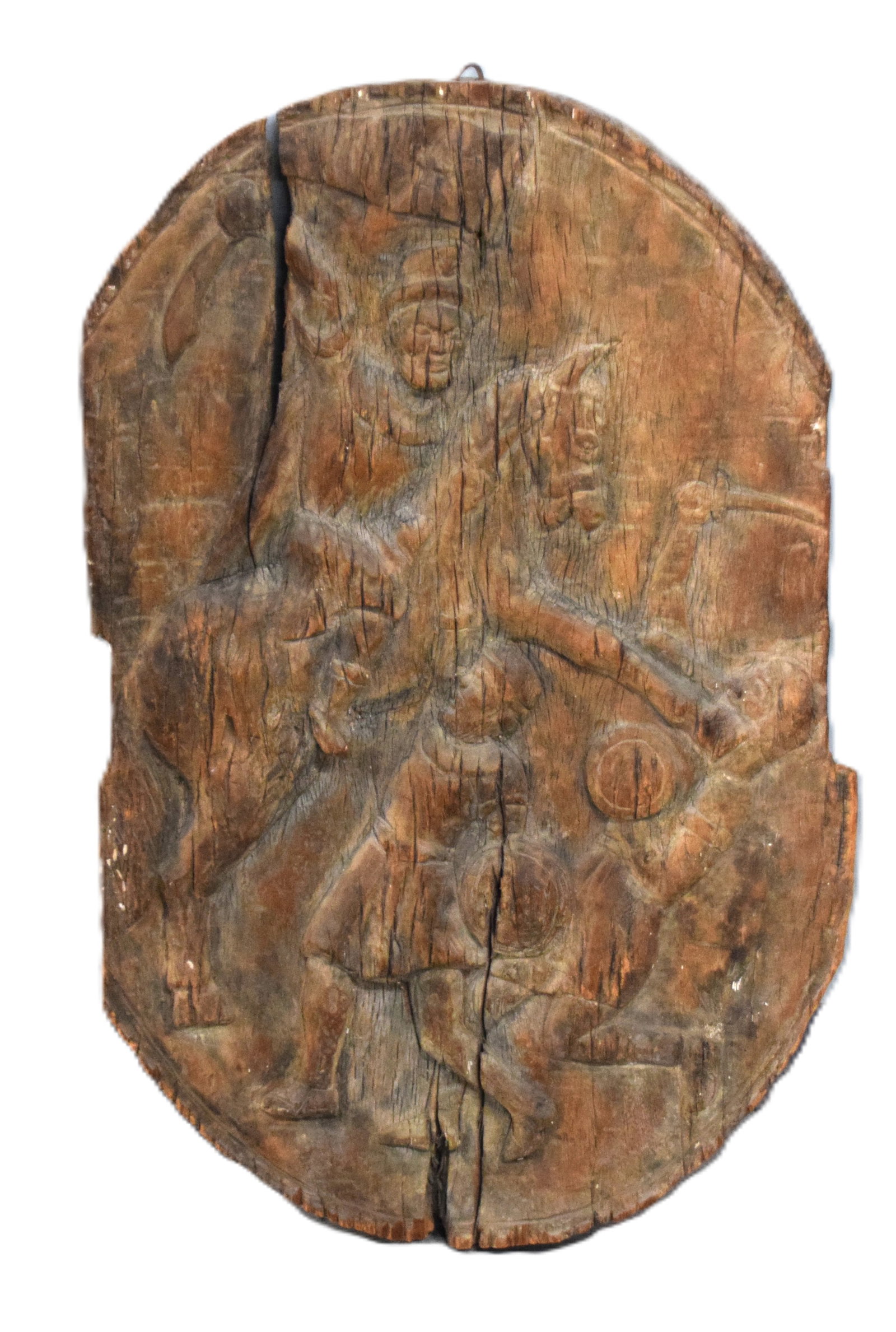 15th Century Persian Wooden Shield: Carved 15th Century Persian wooden shield depicting a cavalry soldier fighting two foot soldiers, Most likely a ceremonial shield. Very rare. Dimensions: 34." H x 21" W.