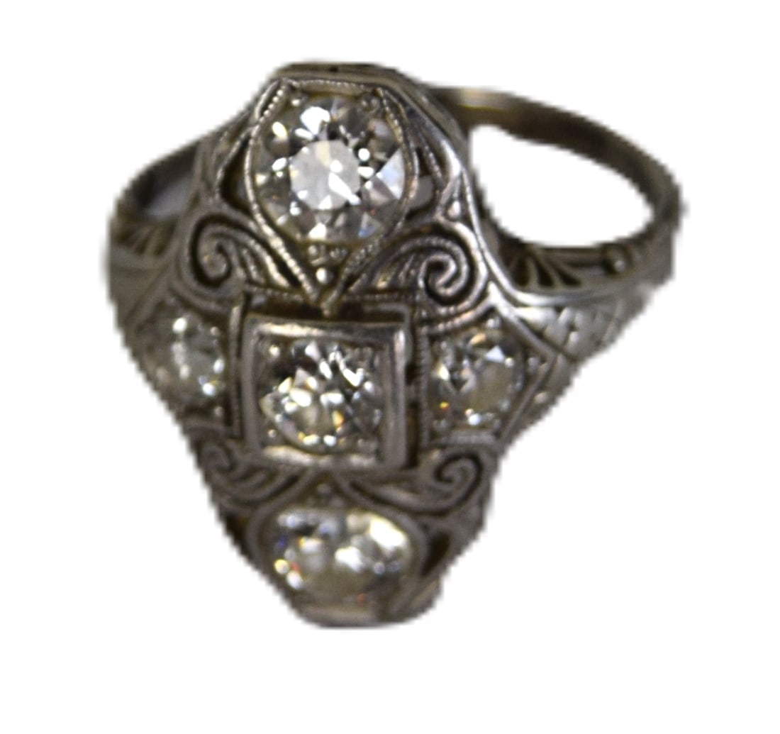 Art Deco Lady's Diamond Ring: Art Deco lady's diamond ring with arrangement of 5 diamonds set in white gold stamped 18K, circa 1920s. Approximately 3.7 Grams