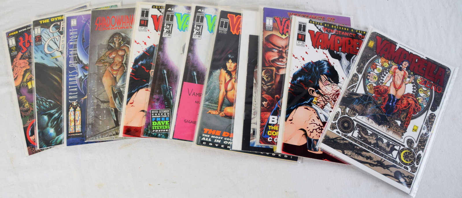 Twelve Signed Vampirella Comics Including #0 Red edition: Ten signed comics of Vampirella Harris Comics including Vampirella # 0, Vengeance of Vampirella #1 (2 copies), Vampirella Bloodshed, Mystery Walk-Supplement to Wizard,Dracular War, Vampirella #4
