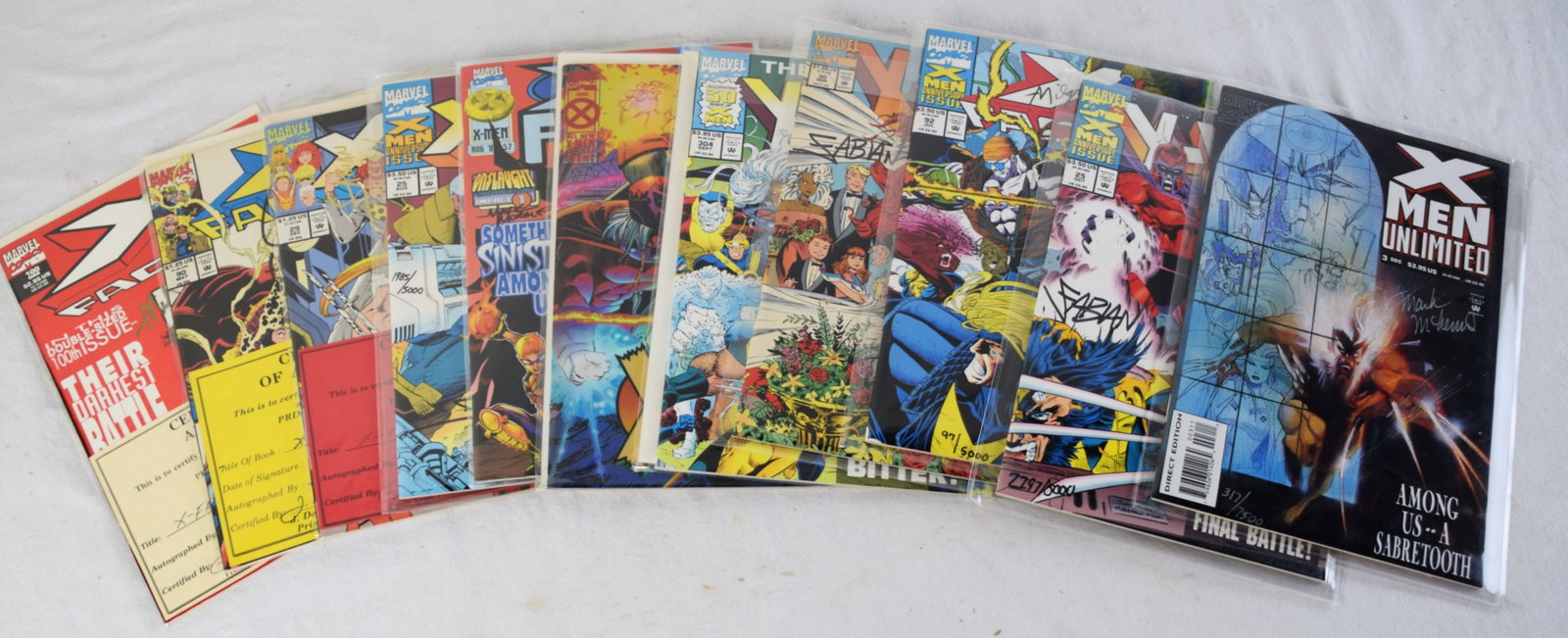 11 Signed X Men, X Force and X Factor Comics: Eleven comics including X Men signed #3, #25, #92, #30,and unsigned #304 and Special Event June; X Force signed #25, #29, #57 and X Factor signed #90 and #100. Most have Certificates of Authenticity