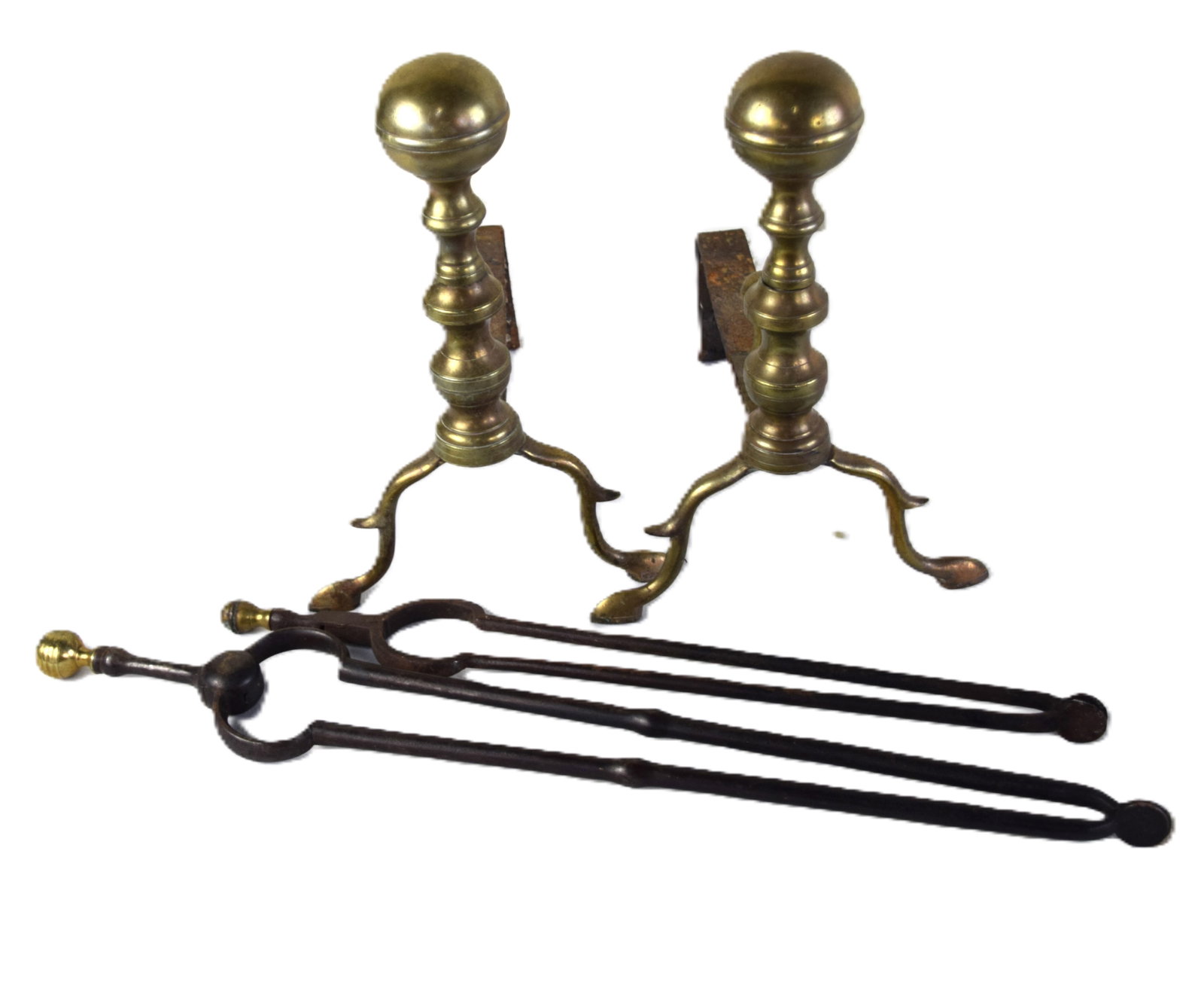 Pair Of Chippendale andirons And Related: A pair of 18th Century Chippendale cannon ball andirons with stoppers in brass along with two early brass top fire tongs along with several iron accessories