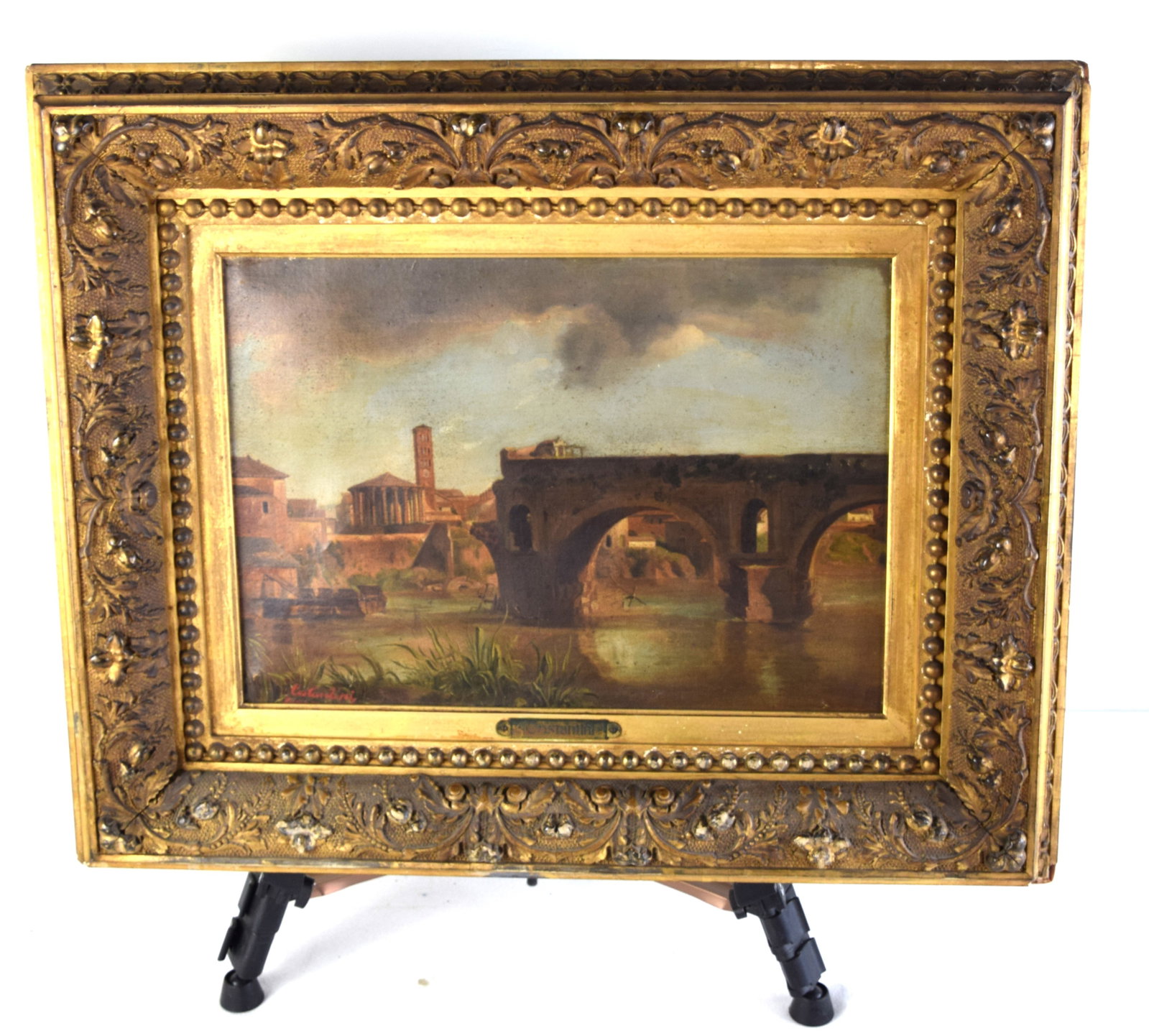 Giuseppe Costantini Italian Landscape: Framed oil on canvas landscape of an Italian city with a half destroyed arch bridge. Signed lower left Costantini along with a nameplate. Giuseppe Costantini(1844 1894} born in Nola. Italy was known