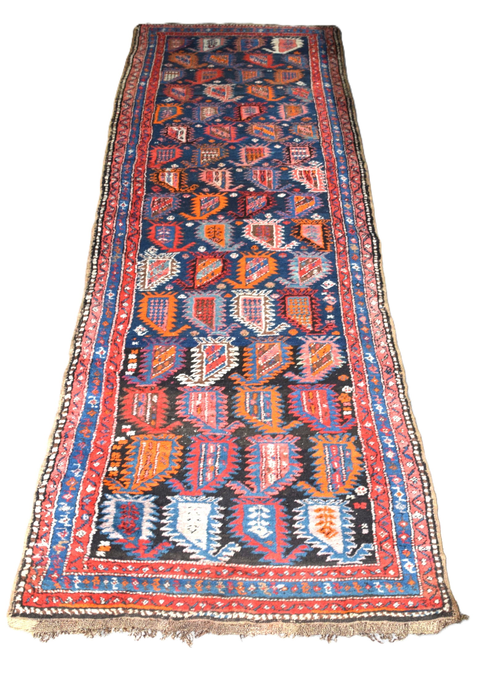 Oriental Runner: Good early oriental runner with multiple designs and multi-colors of red, blue and ivory. Dimensions" 3' x 10'1"