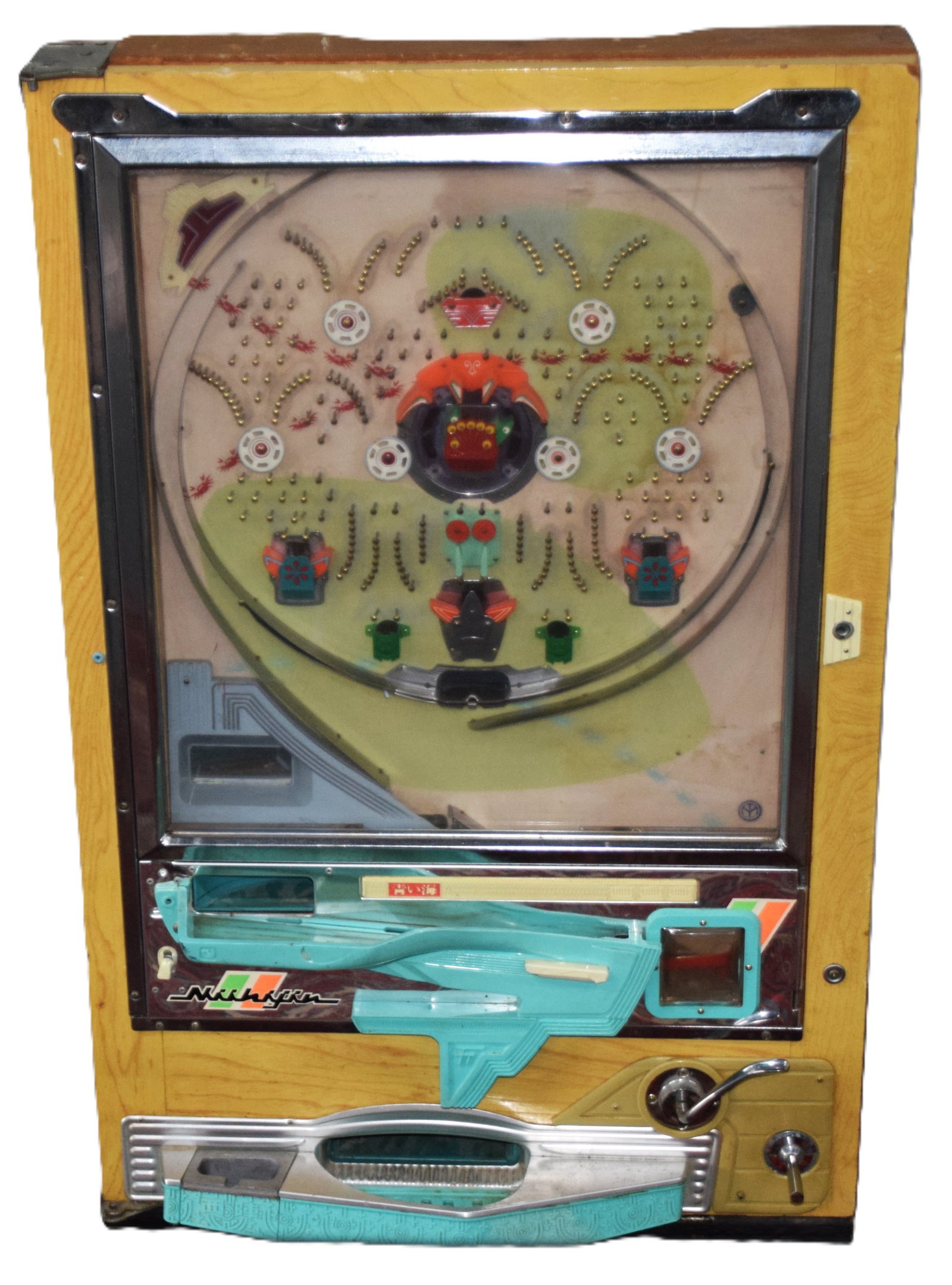 Nishijin Pachinko Machine: Nishijin pachinko machines are highly popular vintage mechanical arcade games produced by the Nishijin company (Tokyo/Kyoto) throughout the 1960s and 1970s. They are mostly all-mechanical, relying on