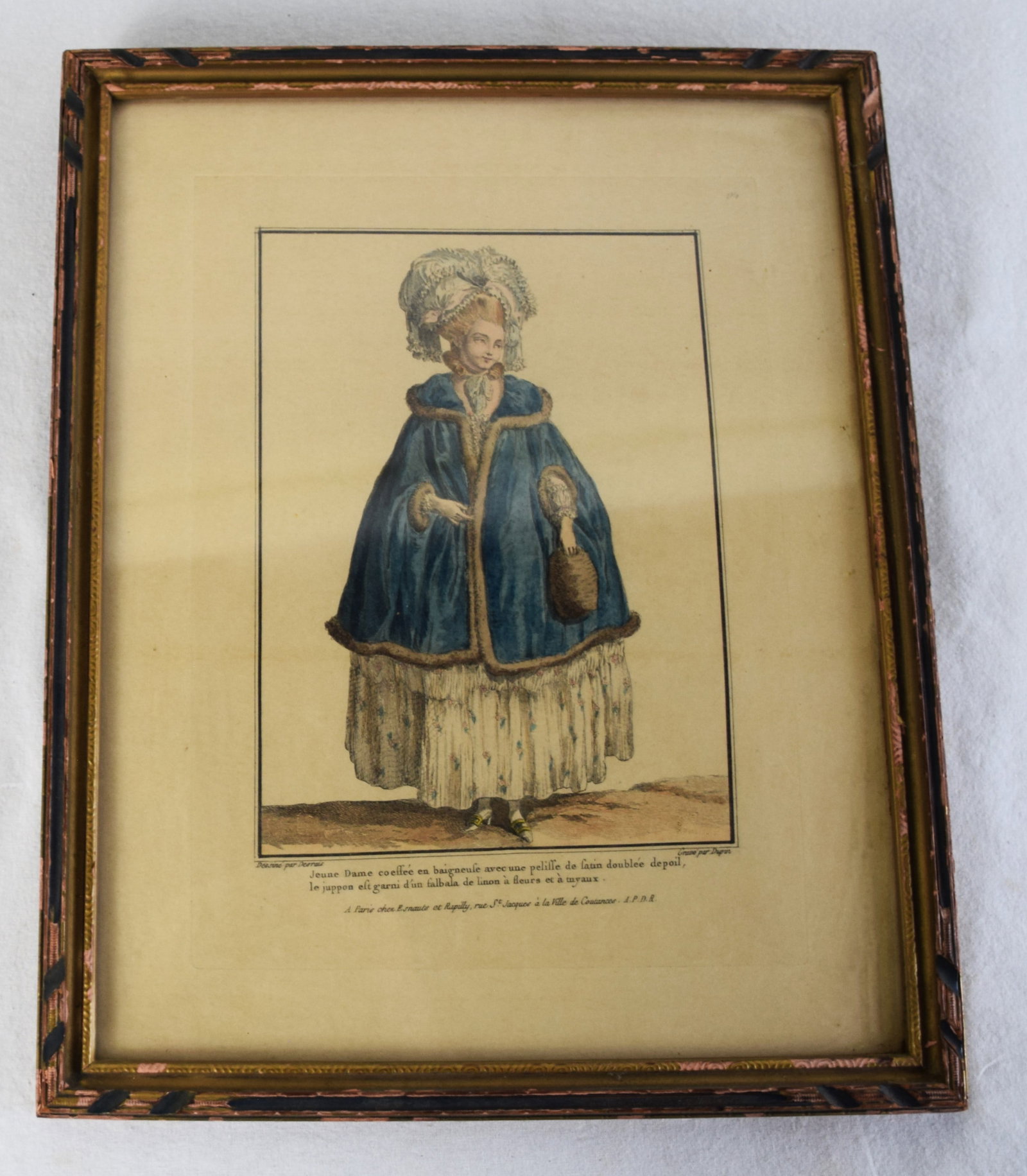 Two Piece Art Lot: Two piece art lot including a framed 18th century print of an elegant young women dressed in fashion clothes with French descriptions and title below image as well as watercolor of a lake scene with