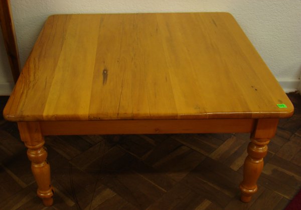 YELLOW WOOD COFFEE TABLE: YELLOW WOOD COFFEE TABLE, with a moulded edge top, on turned legs, with apron. 90cm square x 44cm tall. EST.R600-1000.
