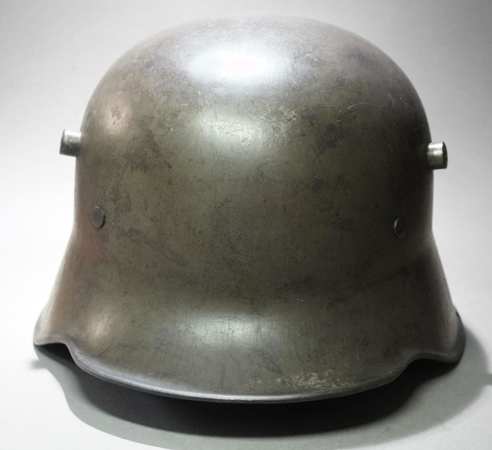 German M16 Stahlhelm.: German M16 Stahlhelm. Steel helmet design providing protection against shrapnel and grenade fragments. The hornlike lugs on either side are for the attachment of a brow protection device. The M16 helm