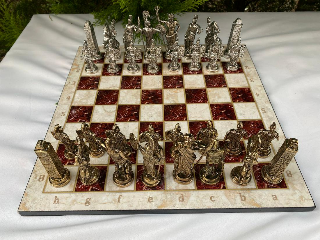 Chess set handcarved figurines wooden board metal: Chess Pieces made of metal. Chess Pieces being cast zinc alloy and older with special coatings and paints with high quality workmanship and manual labor. Board is made of wood. "Board size: 14 x 14 in