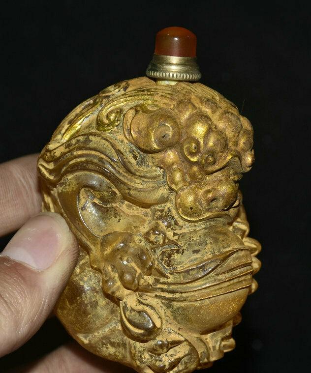 Old Chinese Dynasty Glass Liuli Gilt Snuff Bottle Foo Dog Lion Glass: Great piece of valuable collection! Very rare! Has incredible detailling. Was created by skilled craftsmen in traditional style with fine handcrafts. Could be a very good present. The detailing of the