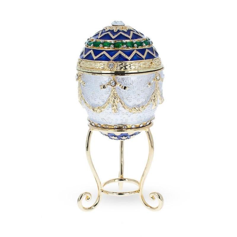 1903 Bonbonniere Clock Royal Russian Faberge Egg collectible: DESCRIPTION: This hand-painted sparkling egg is adorned with a high-polished blue enamel with golden trim.It is decorated with gold enameled garlands. This beauty stands on a golden stand.The egg open