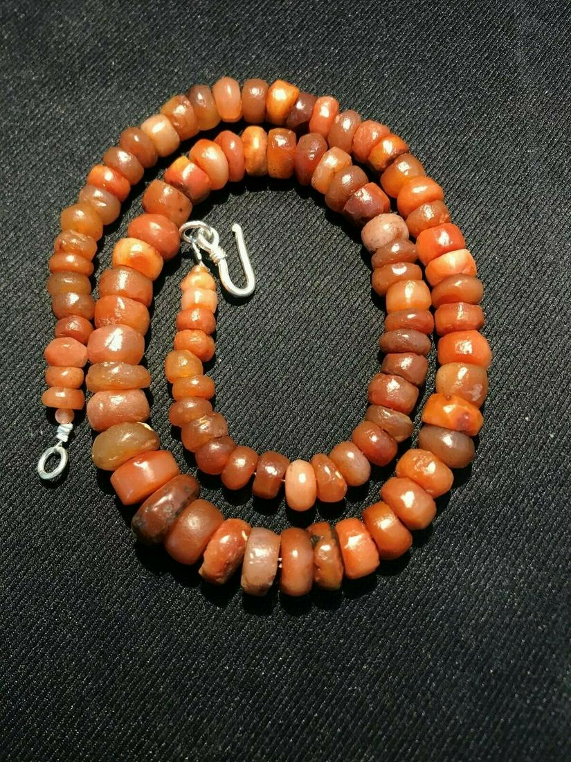 Vintage handbeaded carnelian beads necklace jewelry: A beautiful collection of vintage beads is in good condition. A necklace is made of carnelian beads. They are found in Afghanistan, India, Pakistan and Tibet. They can be used to make a beautiful cont