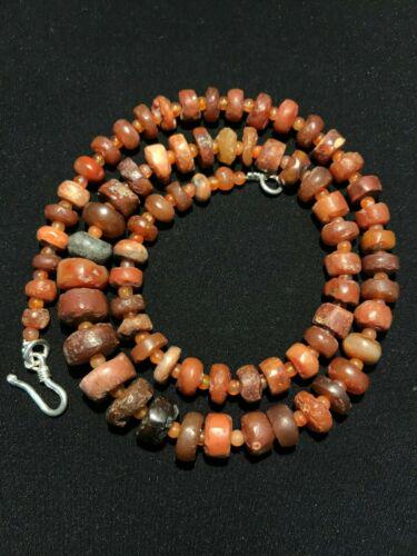 Vintage pendant carnelian beads necklace jewelry coral: This is vintage beads necklace. Made of Carnelian beads. Each bead is authentic and vintage. Beads have different size and shape. The age of these beads are more than 2000 years old. Rich In Patina. C