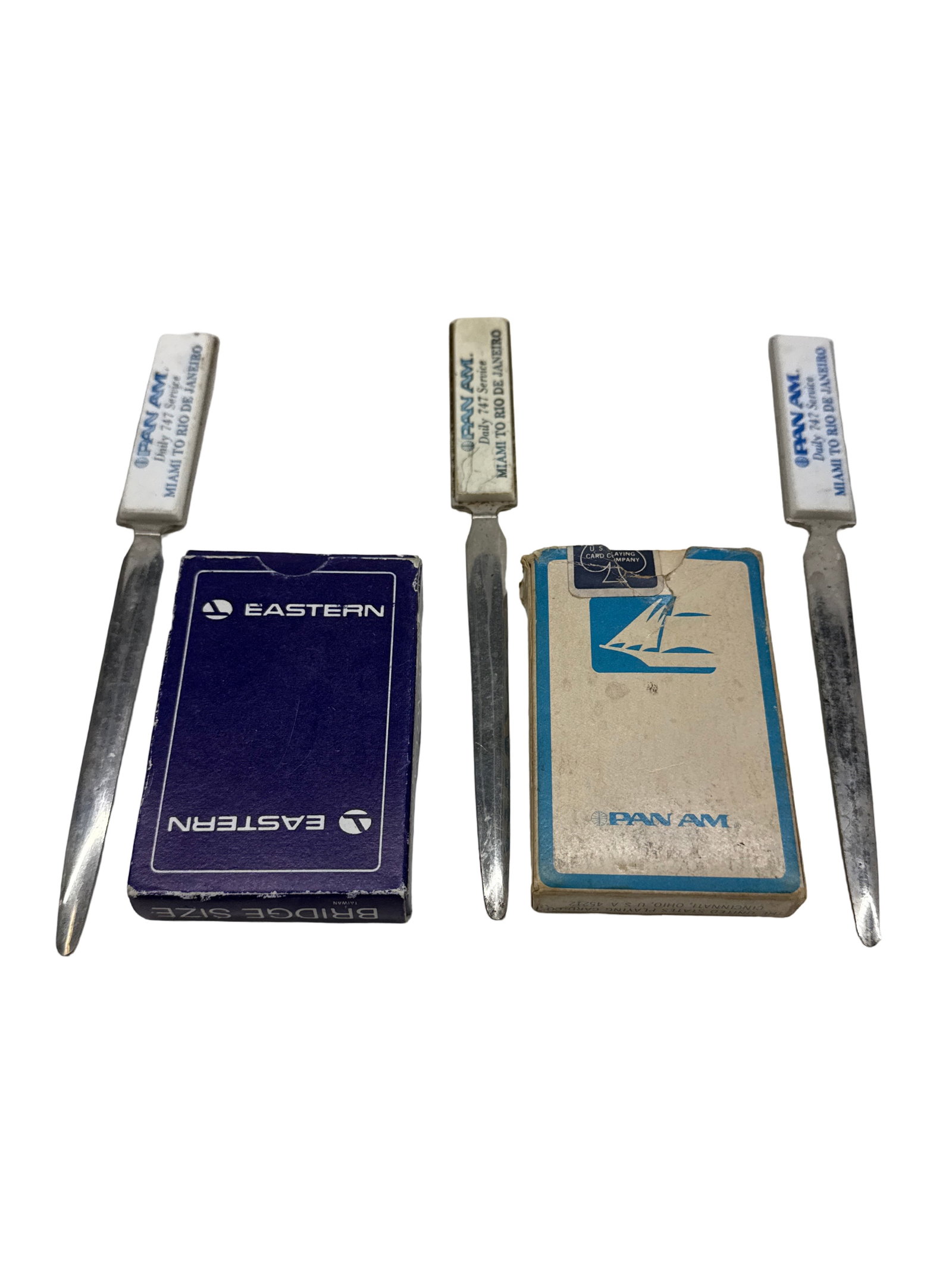 Vintage Pan Am and Eastern Airlines Coolectibles: Vintage Pan Am and Eastern Airlines Collectibles including decks of cards and letter openers.