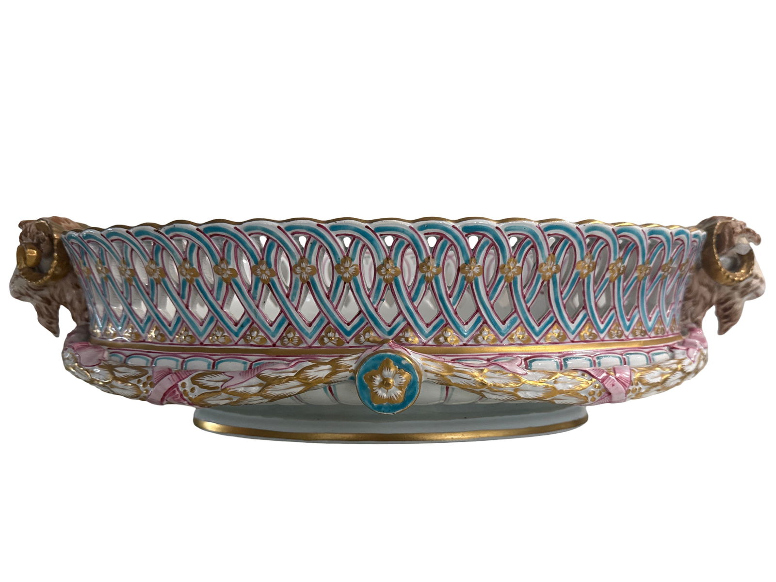 A KELLER & GUERIN LUNEVILLE FAIENCE CENTERPIECE BASKET, FRENCH, CIRCA 1900,: A KELLER & GUERIN LUNEVILLE FAIENCE CENTERPIECE BASKET, FRENCH, CIRCA 1900,a pierced faience basket with ram's head handles, marked on base, "KG LUNEVILLE."5 1/2 x 20 x 10 1/2 in. (14 x 50.8 x 26.7