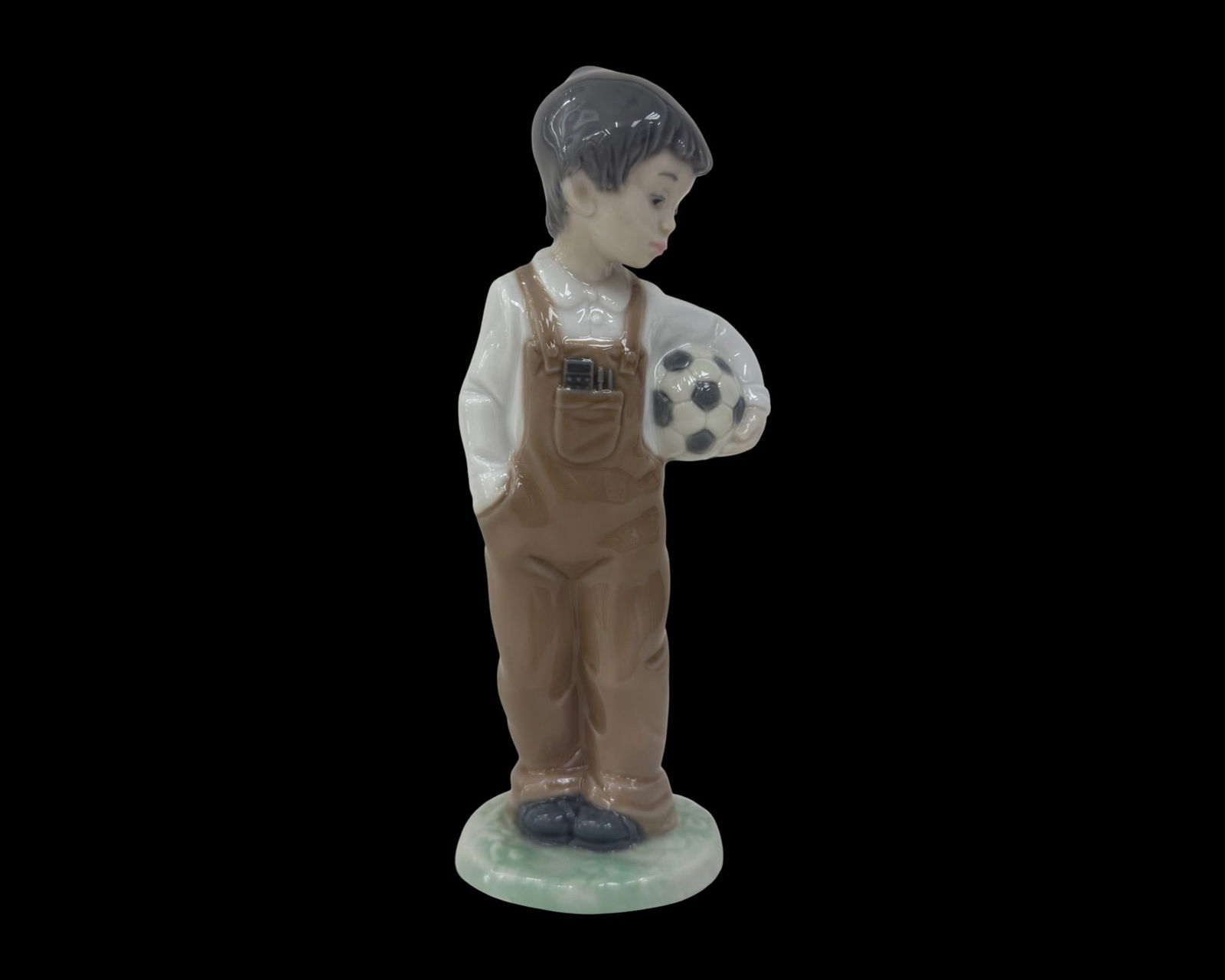 Nao by Lladro Figurine, Wanna Play 1068: NAO by Lladro "Wanna Play" Soccer Boy, #1068. Measures 7-1/2 x 3 inches. Condition is Very good. No damage.
