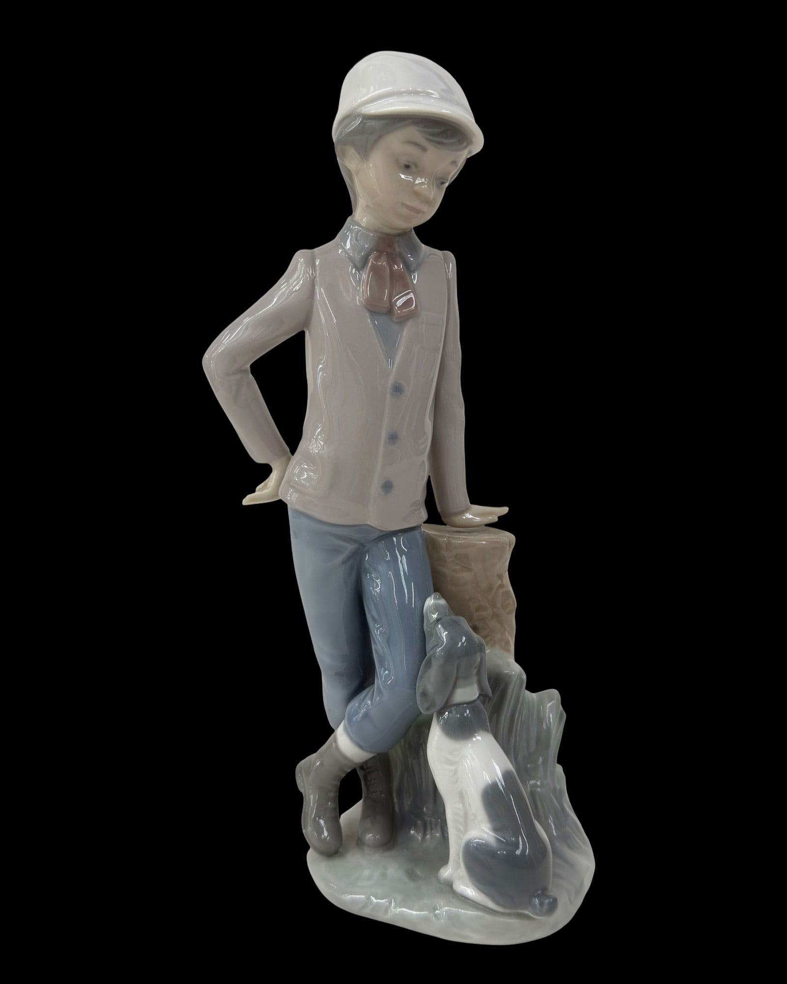 Lladro "Affectionate Pup" Porcelain Figure: Lladro "Affectionate Pup" Porcelain Figure. Measures approx. - 9 1/8" high x 3 1/2" wide.