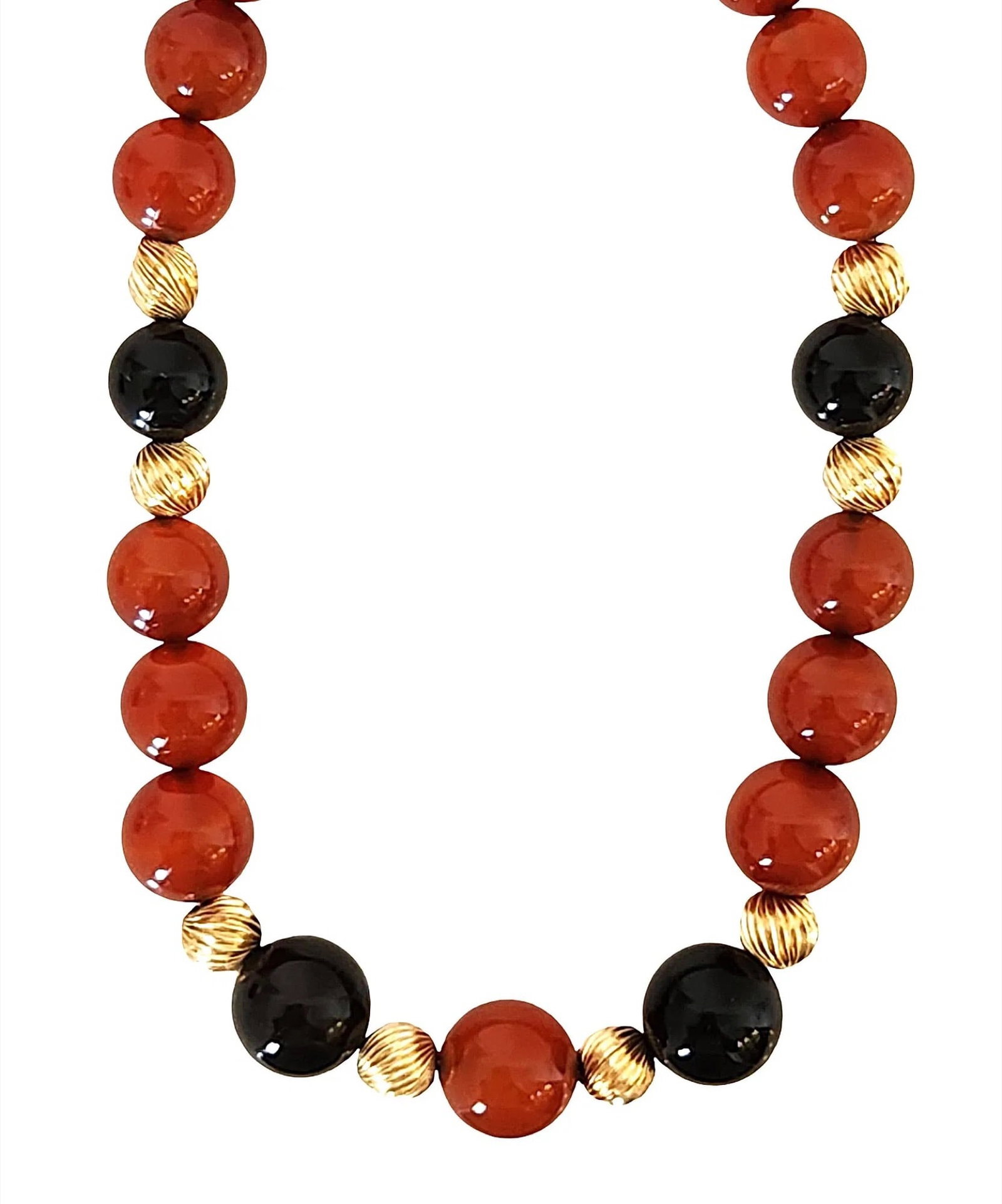 Vintage 14K Gold Carnelian & Black Onyx Beaded Necklace: Elegant vintage beaded necklace featuring rich carnelian gemstone beads accented with black onyx beads and decorative 14K yellow gold spacer beads. The warm reddish-orange tones of the carnelian contr