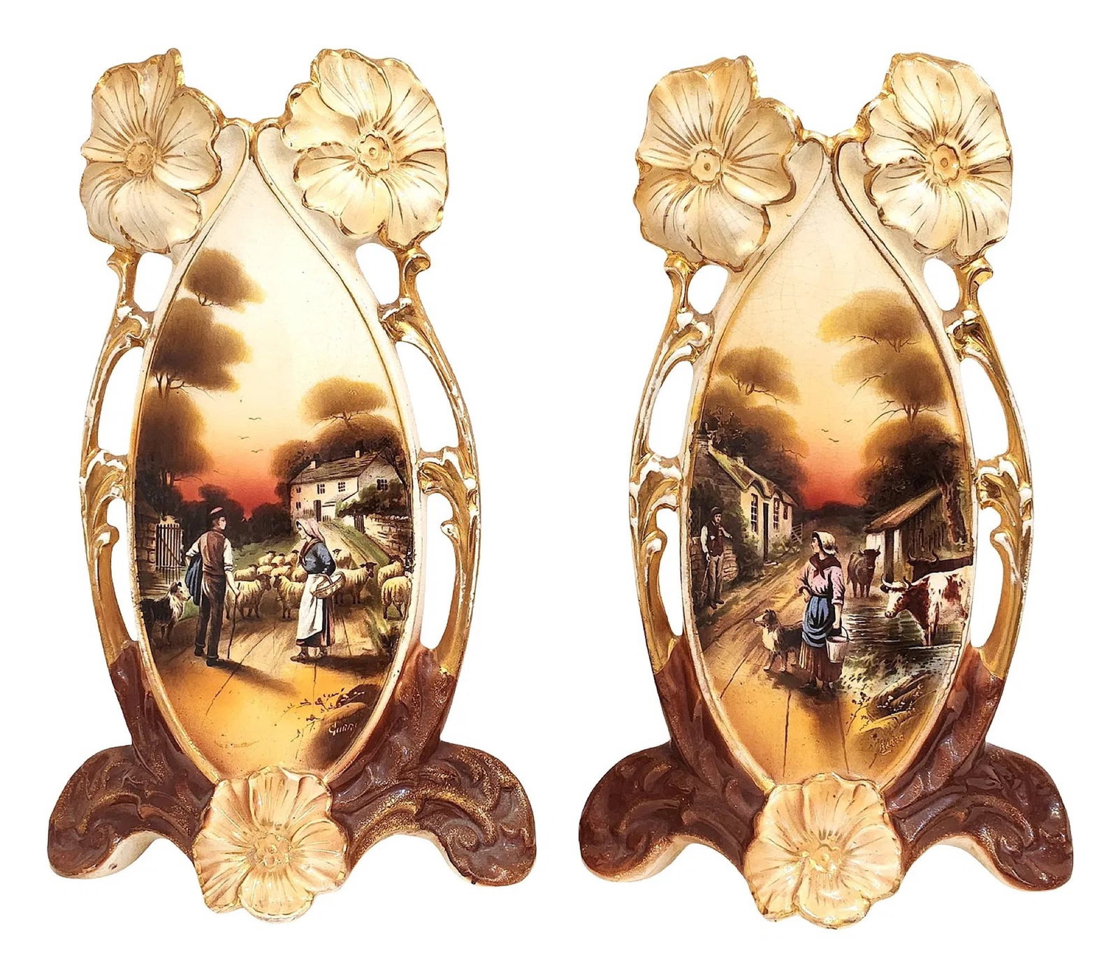 Pair of Art Nouveau Hand-Painted French Porcelain Vases, Signed and Dated: A decorative pair of Art Nouveau style porcelain vases featuring elongated forms with openwork handles and applied floral motifs at the rim and base. Each vase is richly decorated with hand-painted