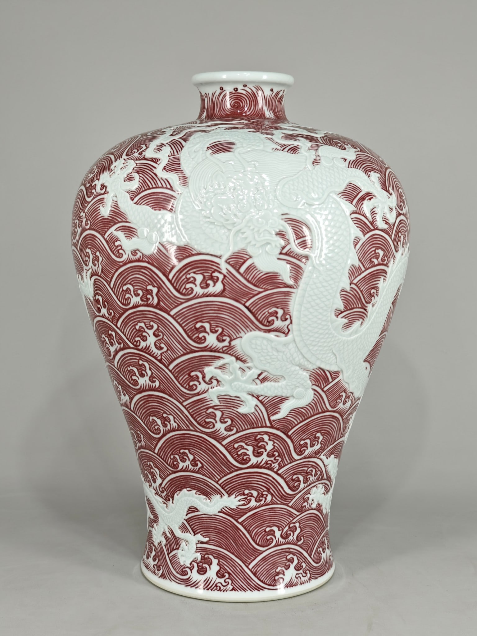 A large Yongzheng style carved Canglong Jiaozi underglaze red plum vase (1 of 9)