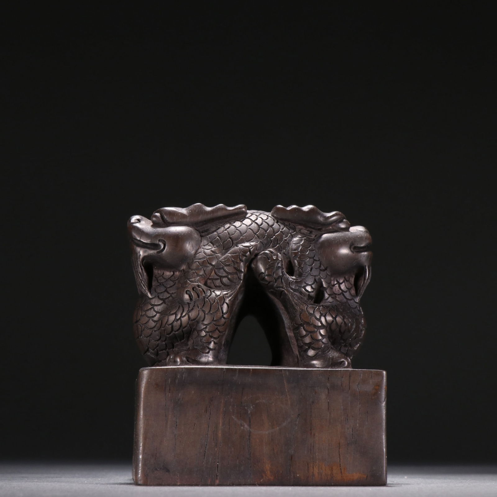 A agarwood dragon button seal (1 of 9)