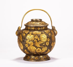 A gilded teapot