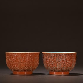A Pair Of Red Glazed Porcelain Carved Flower Patterned Cups