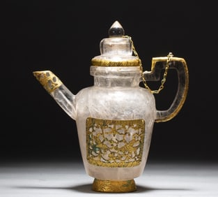 A gold-plated crystal teapot