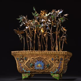 A silver gilded floral silk fired blue bonsai