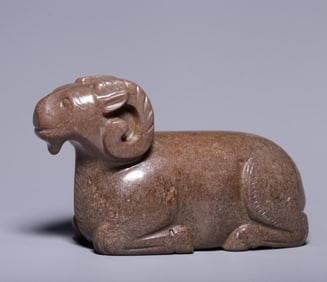 An ancient jade lying sheep ornament