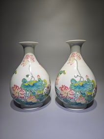 A pair of spring vases made in the Yongzheng year of the Qing Dynasty, featuring pink lotus flowers,